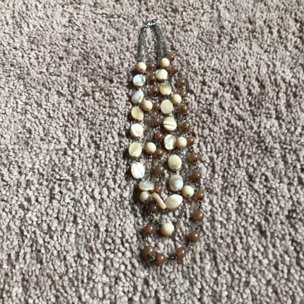 Multi string tan and cream necklace